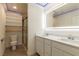 Bathroom featuring double vanity, modern lighting and glass-enclosed shower at 8446 Vacarez Dr, Las Vegas, NV 89149