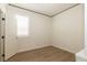 A well-lit bedroom offers a serene space with a large window at 8446 Vacarez Dr, Las Vegas, NV 89149