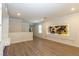 Spacious bonus room features modern lighting, stylish decor, and wood-look laminate flooring at 8446 Vacarez Dr, Las Vegas, NV 89149