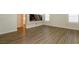 Bonus room with laminate flooring, modern wall art and shuttered windows at 8446 Vacarez Dr, Las Vegas, NV 89149