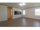 Bonus room with a large piece of art and windows providing natural light at 8446 Vacarez Dr, Las Vegas, NV 89149