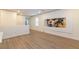 Bonus room with luxury vinyl plank flooring, large art, and plenty of space at 8446 Vacarez Dr, Las Vegas, NV 89149