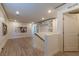 Bonus room with built in shelving and artwork, and wood look flooring at 8446 Vacarez Dr, Las Vegas, NV 89149