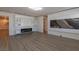 Bonus room featuring a modern fireplace, built in shelving, and luxury vinyl floors at 8446 Vacarez Dr, Las Vegas, NV 89149