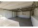 Well-organized garage with custom white cabinetry and overhead storage racks for maximum space at 8446 Vacarez Dr, Las Vegas, NV 89149