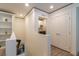 Hallway looking into a laundry room with appliances at 8446 Vacarez Dr, Las Vegas, NV 89149