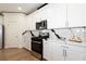 A modern kitchen with stainless steel appliances and white cabinetry at 8446 Vacarez Dr, Las Vegas, NV 89149