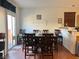 Dining room with dark wood table, chairs, and access to the backyard at 9299 Adamshurst Ave, Las Vegas, NV 89148