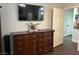 Bedroom features dresser with a TV, next to an open door leading to another room at , Las Vegas, NV 89129