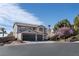 Two-story home with a three-car garage and desert landscaping at , Las Vegas, NV 89129