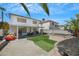 Outdoor entertaining is a breeze with a covered patio, lush artificial turf, and well-kept landscaping at 10218 Maltese Cross Ct, Las Vegas, NV 89183
