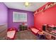 Bedroom featuring two beds, colorful walls, and shelving at 10218 Maltese Cross Ct, Las Vegas, NV 89183