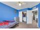 Bedroom with a closet, gray dresser, and a door leading to the laundry room at 10218 Maltese Cross Ct, Las Vegas, NV 89183