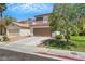 Attractive two-story home with a well-kept lawn and a convenient two-car garage at 10218 Maltese Cross Ct, Las Vegas, NV 89183