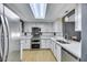 Modern kitchen featuring stainless steel appliances, white cabinetry, and sleek countertops at 10218 Maltese Cross Ct, Las Vegas, NV 89183