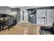 Spacious living area featuring hardwood floors, a staircase, and stylish gray walls at 10218 Maltese Cross Ct, Las Vegas, NV 89183