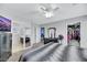 Spacious main bedroom with carpet, ceiling fan, and an en-suite bathroom at 10218 Maltese Cross Ct, Las Vegas, NV 89183