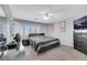 Relaxing main bedroom with carpet floors, a ceiling fan, and natural light at 10218 Maltese Cross Ct, Las Vegas, NV 89183