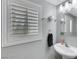 Powder room with white fixtures and modern lighting at 10218 Maltese Cross Ct, Las Vegas, NV 89183