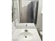 Bathroom featuring a sink with cabinet and tiled shower with curtain at 10525 Autumn Pine Ave # 203, Las Vegas, NV 89144