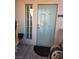 Condo entrance featuring a light blue door, adjacent window, and a welcoming outdoor mat at 10525 Autumn Pine Ave # 203, Las Vegas, NV 89144
