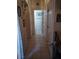 Hallway view featuring tile flooring, white doors and trim, and hallway lighting at 10525 Autumn Pine Ave # 203, Las Vegas, NV 89144