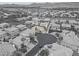 Neighborhood aerial shot showcasing community homes, the surrounding landscape, and mountain views in the distance at 11002 Inverlochy Ct, Las Vegas, NV 89141