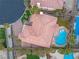 Stunning aerial view of a home with a tile roof and a backyard featuring a beautiful private pool at 11002 Inverlochy Ct, Las Vegas, NV 89141
