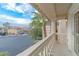 This covered balcony offers neighborhood views, classic white railings and trim, and protection from the elements at 11002 Inverlochy Ct, Las Vegas, NV 89141