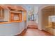 Entertainment area with a wet bar, custom cabinetry, and wine storage at 11002 Inverlochy Ct, Las Vegas, NV 89141