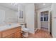 Inviting bathroom with neutral walls, tiled floors, a standup shower and a large mirror at 11002 Inverlochy Ct, Las Vegas, NV 89141