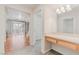 Bright bathroom vanity area with tile flooring and natural lighting at 11002 Inverlochy Ct, Las Vegas, NV 89141
