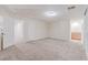 Spacious bonus room features neutral carpeting, a large window with shutters, and a recessed ceiling light at 11002 Inverlochy Ct, Las Vegas, NV 89141