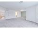 Large bonus room with neutral carpet, recessed lighting, and a glimpse of the staircase at 11002 Inverlochy Ct, Las Vegas, NV 89141