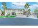 Beautiful two-story home featuring lush landscaping, a paver driveway, and a three-car garage at 11002 Inverlochy Ct, Las Vegas, NV 89141