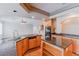 Bright kitchen features granite countertops, a spacious island, and wood cabinets at 11002 Inverlochy Ct, Las Vegas, NV 89141