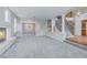 Spacious living room featuring neutral paint, carpet, and an elegant fireplace at 11002 Inverlochy Ct, Las Vegas, NV 89141