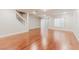 Open living room with hardwood floors and sliding glass door at 11002 Inverlochy Ct, Las Vegas, NV 89141