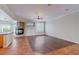 Open living room with a cozy fireplace, tile, wood flooring, and abundant natural light at 11002 Inverlochy Ct, Las Vegas, NV 89141