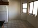 This dining area has tile floors, natural light, and a modern white refrigerator at 1105 Sulphur Springs Ln # 102, Las Vegas, NV 89128