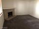 Living room featuring a brick fireplace with a raised hearth at 1105 Sulphur Springs Ln # 102, Las Vegas, NV 89128
