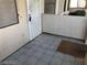 Tiled front patio with a decorative metal security door at 1105 Sulphur Springs Ln # 102, Las Vegas, NV 89128