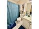 Bright bathroom featuring a shower-tub, single sink vanity and white medicine cabinet at 1105 Sulphur Springs Ln # 202, Las Vegas, NV 89128