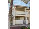Charming condo exterior showcasing a private entrance with stylish architectural details and desert landscaping at 1105 Sulphur Springs Ln # 202, Las Vegas, NV 89128