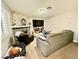Inviting living room with stone fireplace, comfortable seating, and ample natural light at 1105 Sulphur Springs Ln # 202, Las Vegas, NV 89128