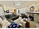 Open living space with a stone fireplace that connects to the kitchen and dining area at 1105 Sulphur Springs Ln # 202, Las Vegas, NV 89128