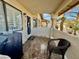 This patio has tile flooring, seating, and a door to the unit at 1105 Sulphur Springs Ln # 202, Las Vegas, NV 89128