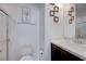 Bright bathroom featuring a modern vanity, framed mirror and walk-in shower at 1135 Tektite Ave, Henderson, NV 89011