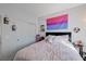Bedroom with closet, queen bed, and bisexual pride flag at 1135 Tektite Ave, Henderson, NV 89011