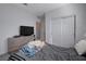 View of bedroom including closet, tv, dresser and bedding at 1135 Tektite Ave, Henderson, NV 89011